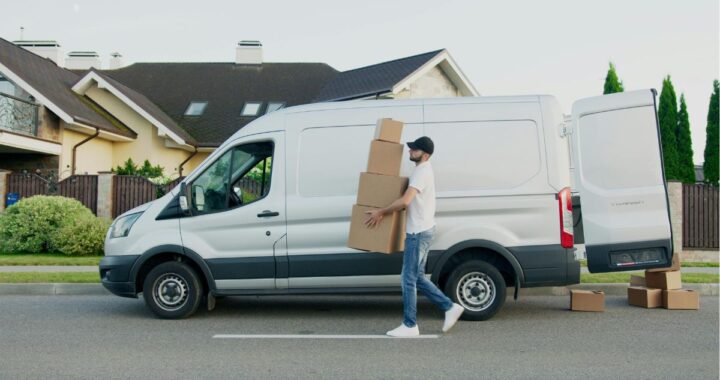 moving trucks outside home — leading moving companies NJ in action” “professional movers loading truck — top Jersey City moving company service”