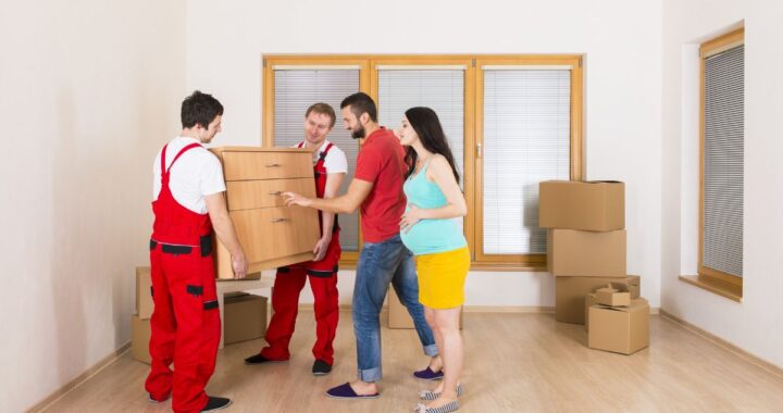 Jersey City moving company team packing boxes for relocation Professional movers Newark NJ loading furniture into a truck Affordable moving services in Jersey City and Newark NJ