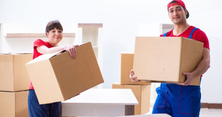 Movers in Newark NJ loading household items Top Jersey City moving company packing furniture Moving truck and crew working in Newark NJ