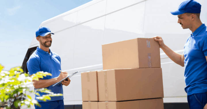 Team from a top Jersey City moving company and expert movers in Newark NJ carrying boxes during a residential move