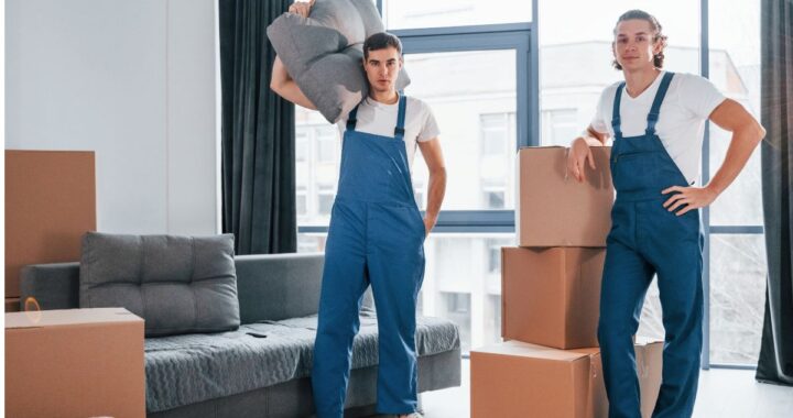 Moving team in NJ carrying boxes during relocation